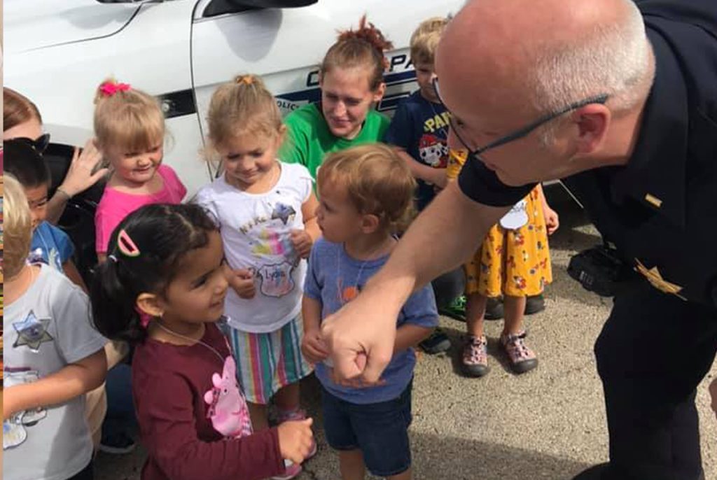 Officer engaging with group of children